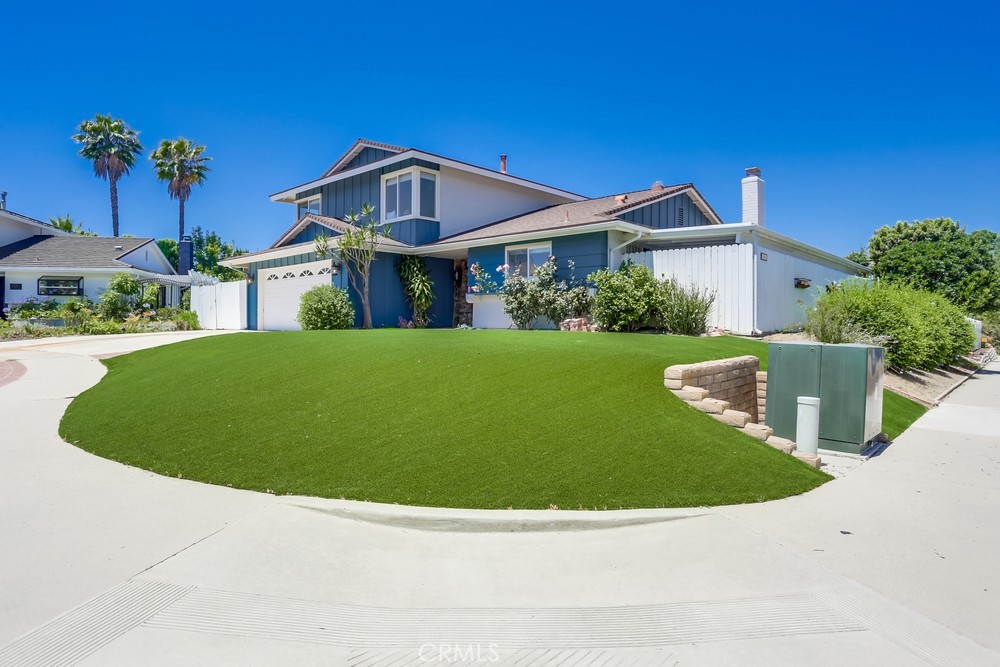 Welcome to 25001 MacKenzie St, a charming two-story home tucked on a spacious corner lot in the heart of Laguna Hills. With great curb appeal, an extended driveway, manicured turf lawn, and a welcoming red double-door entry, this property offers space, character, and the opportunity to make it truly your own.
Step inside to find tile flooring and freshly painted walls that create a bright and inviting atmosphere. To the right, a formal dining room sits just off the kitchen—perfect for gatherings and meals. The kitchen features upgraded countertops and ample cabinet space. Further down the house leads into a brightly-lit living room complete with a brick-accented fireplace for added warmth, and sliding doors to the patio.
Toward the back of the home, a spacious bonus room—ideal as a game room, or second living space—opens to the backyard through additional sliding glass doors. A full bathroom with shower and access to the attached 2-car garage complete the downstairs layout, offering both functionality and flexibility.
Upstairs, you’ll find the three well-appointed bedrooms, including a primary suite with direct access to a shared bathroom. All bedrooms are well-sized, feature windows for natural light, and closets for ample storage.
Step outside to discover the home’s true potential. The backyard offers a generous mix of patio space and greenery, with a large side yard that expands the usable outdoor square footage dramatically. Fruit trees and mature vegetation add life and privacy to the space, making it ideal for entertaining, gardening, or relaxing. With plenty of room to customize, this outdoor area is a blank canvas waiting for your personal touch.
Full of charm and possibilities, 25001 MacKenzie St is a rare corner-lot opportunity in a desirable Laguna Hills neighborhood. Don’t miss your chance to make this versatile property your next home.