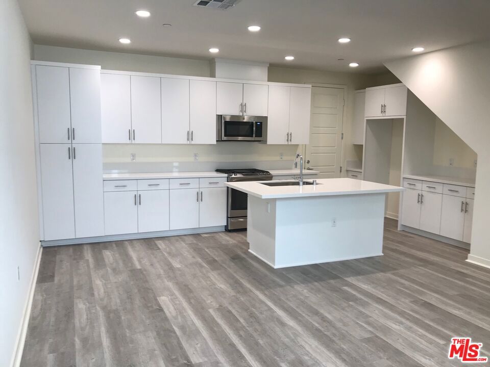 Gorgeous, new 2-story Townhome for lease located in the beautiful and desirable Gated community development known as "The District!" Newly built in 2018 with 1462 sq. ft. of living space, 3 bedrooms & 2.5 bath. Master bedroom has a good-sized walk-in closet + ensuite bathroom w/ private commode, dual sinks, and shower with sitting bench. Bathtub in 2nd upstairs bathroom. Convenient upstairs hookups for washer/dryer. Many amenities throughout, including stove & microwave in the open style kitchen. Direct access, 2-car garage. The community enjoys an AMAZING hotel-like Clubhouse w/ covered open-air great rooms, (2) TV viewing area, BYO-Bar, outdoor Kitchen & Dining areas, Pool/Spa, Cabanas, outdoor Showers, Bathrooms, BBQ area, plus (2) fabulous Fireplaces & a Firepit! Walking distance to Northridge Fashion Center + many nearby restaurants, movie theaters, fitness centers, banks, and houses of worship. Luxurious rental living at it's best! NO PETS please. NO SMOKING please. Tenant to carry renter's and liability insurance. Easy to show with advance notice.