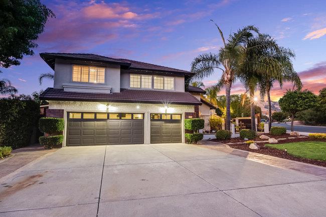 Nestled in the foothills of Evergreen in a highly desired neighborhood. This executive corner-lot home sits on a quiet cul-de-sac and offers one of the neighborhoods largest floor plans. 5 bedrooms and 3 bathrooms across 3,458 sq. ft. residence features soaring ceilings, a 3-car garage, and a seamless blend of hardwood and brand new plush carpeting upstairs. The chefs kitchen impresses with white shaker cabinets, quartzite countertops and stainless steel appliances, opening to the spacious family room. Formal living and dining rooms with vaulted ceilings create an inviting atmosphere for entertaining. The enclosed patio serves as an entertainers paradise with wood-planked ceilings, ceiling mounted heaters, wood-burning fireplace accented by custom stacked stone, outdoor TVs, built-in BBQs and gas burners. The expansive 8,000 sq. ft. lot provides room for basketball, pickle ball, or extra parking. A coveted ground-floor bedroom with full bath is perfect for guests or an office, and the oversized fifth bedroom offers flexibility as a bonus room, playroom, or gym. Located directly across the street from Montgomery Hill Park walking trail. Close to parks, Evergreen Community Center, Evergreen Valley College, and top Evergreen schools. This is a rare opportunity not to be missed!