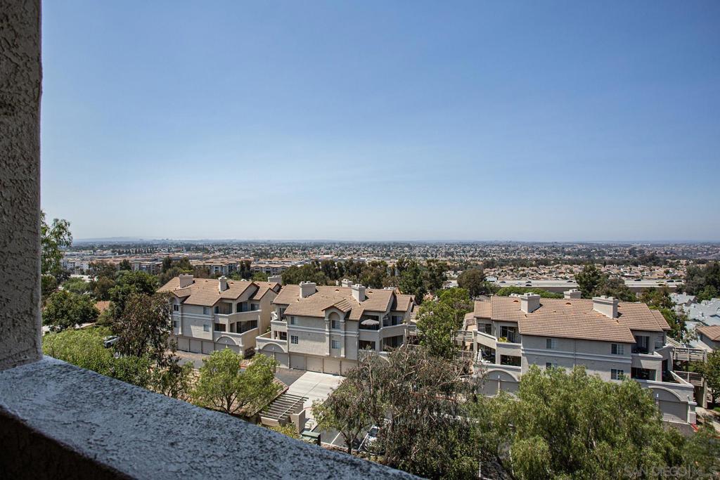 Wonderful 2-bedroom 2-bath townhome with a fantastic panoramic view to the West! A great floor plan with bedrooms separated by the living area - so good privacy. Lots of natural light. There is a beautiful spacious balcony to enjoy the view evening or daytime. The living room and both bedrooms have direct access to the balcony. Fireplace in the living room. Garage access is directly across from the front door - easy access. Beautiful ammenities pool and spa.