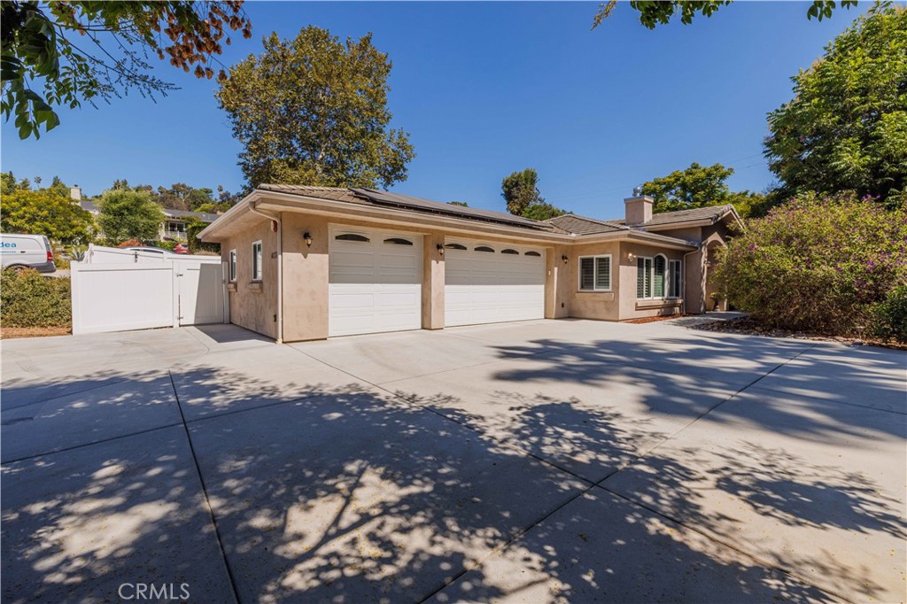 Mt. Helix Multigenerational Single Story custom-built luxury home with an expansive open-concept floor plan with high-end finishes throughout. The modern chef’s kitchen features Monte Cristo granite countertops, stainless steel appliances, soft-close custom cabinetry, and a huge walk-in pantry. Enjoy durable porcelain wood-grain tile flooring in the main living areas and bedrooms. Ensuite bedroom (currently used as a music studio) boasts its own private en-suite bathroom. The primary suite includes a spa-like bathroom with jetted jacuzzi tub, walk-in shower, dual vanity, and a large walk-in closet. Laundry has a utility sink and is located in its own room. Separate office located off main living area.
Two bedrooms have been combined to create a private bonus studio flex-space with its own private entrance, kitchenette, with stacked washer/dryer, and full appliances,private bathroom with a walk-in shower and living/sleeping area—perfect for Multigenerational Living or possible Rental Income (Home includes a bonus studio space with separate entrance-not permitted by the city or county). This is perfect for the commute to SDSU-Only 15 minutes away!
Additional highlights: paid solar, plantation shutters, large laundry room with utility sink, outdoor hot water spigots, above-ground spa with aluminum gazebo, 3-car garage and more. Don’t miss this one-of-a-kind Mt. Helix gem!
