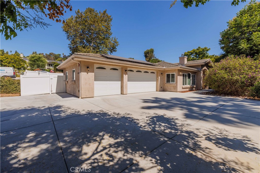 Spring Valley-Casa de Oro neighborhood, Multigenerational Single Story 2016 custom-built home with an expansive open-concept floor plan with high-end finishes throughout. The modern chef’s kitchen features Monte Cristo granite countertops, stainless steel appliances, soft-close custom cabinetry, and a huge walk-in pantry. Enjoy durable porcelain wood-grain tile flooring in the main living areas and bedrooms. Ensuite bedroom boasts its own private en-suite bathroom. The primary suite includes a spa-like bathroom with jetted jacuzzi tub, walk-in shower, dual vanity, and a large walk-in closet. Laundry has a utility sink and is located in its own room. Separate office located off main living area.
Two bedrooms were combined to create a private bonus studio flex-space with its own private entrance, kitchenette, with stacked washer and dryer, all appliances,private bathroom with a walk-in shower and living with a sleeping area, perfect for Multigenerational Living or possible Rental Income (Home includes a bonus studio space with separate entrance; not permitted by the city or county). Located nearby SDSU.
Additional highlights: paid solar, plantation shutters, large laundry room with utility sink, outdoor hot water spigots, above-ground spa with aluminum gazebo, 3-car garage and more. Don’t miss this one-of-a-kind Spring Valley gem!