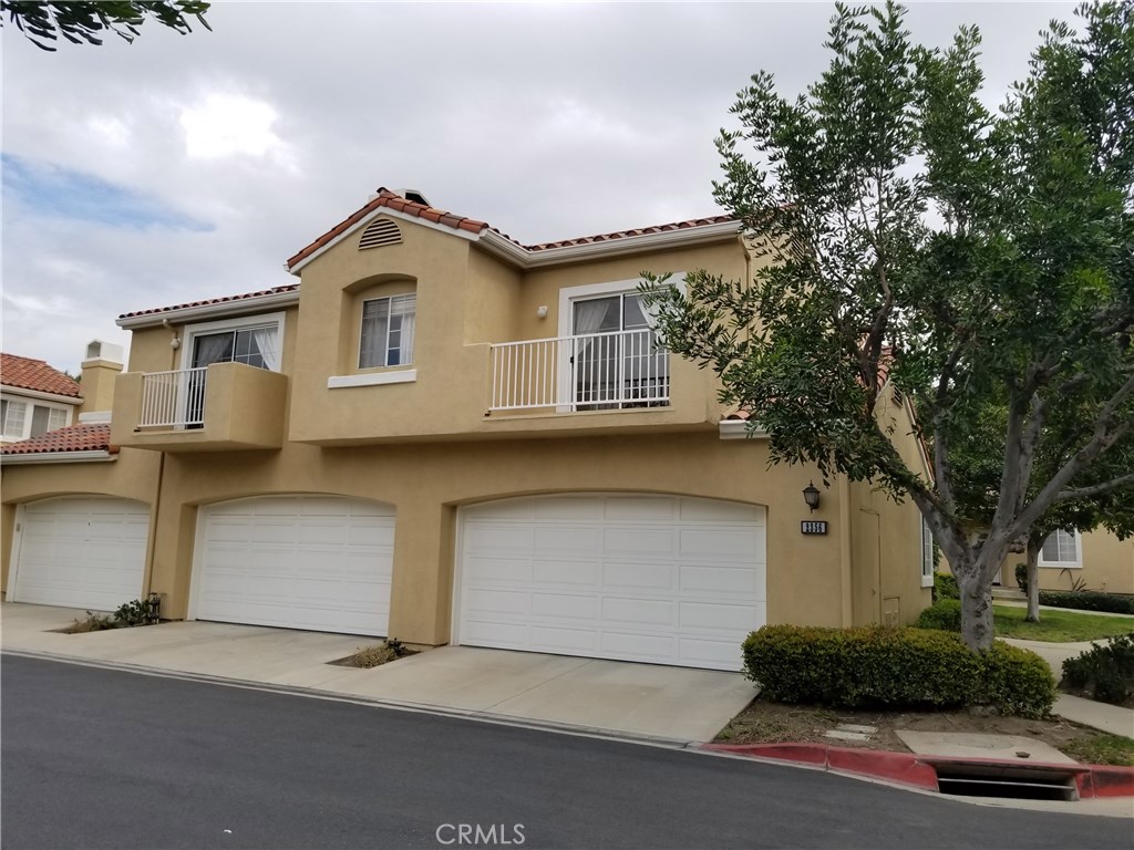 Stunning single level beauty located within resort like gated community. Property offers two bedrooms, 2 bath and two car garage, in addition to an extra large gated patio. No one above or below, turnkey and move in ready with fresh new paint, gorgeous tile flooring and new quality carpet in bedrooms for ultimate coziness and comfort. Living room offers vaulted ceilings, crown molding, fireplace and has its own separate balcony. Dining area with easy access to kitchen is perfectly situated to add spaciousness to the entire living area. Sunny kitchen with bay window, boasts stainless steel appliances, including refrigerator and wine cooler along with wine glass rack. Master bedroom features two separate mirrored closets and double vanity area in addition to its own private balcony. Enjoy inside separate laundry room with washer and dryer. Very large two car attached garage. Plenty of guest parking. Residents enjoy access to resort-style amenities including a large pool and spa, all within a secure, gated setting. Pet friendly. Conveniently located just minutes from the Tustin/Irvine Marketplace, shopping, dining, and Tustin Ranch Golf Club. Truly a gem and an ultimate experience in comfort living. Don't miss this.