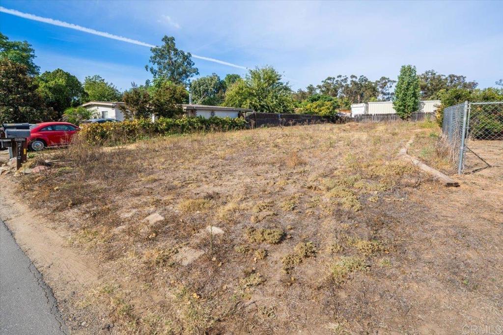 Back on the Market! Residential Lot in the Ramona Acres Subdivision on paved St Discover the perfect canvas for your home in the heart of Ramona This exceptional .15-acre lot offers an idyllic setting for a custom single-family home, combining convenience, tranquility, for your future residence. Nestled in a quaint neighborhood, this property enjoys a private atmosphere while maintaining close proximity to essential amenities. Access is made effortless with easily accessible paved roads, ensuring an easy commute to nearby conveniences. Water & utilities are conveniently located nearby, enhancing the practicality of building on this lot. Immerse yourself in the peaceful established neighborhood, known for its quiet residential character, this community provides a welcoming feel. This lot presents an unparalleled opportunity to bring your vision to life. With its approved septic layout and residential zoning, it offers the ideal foundation for constructing a custom single-family home.