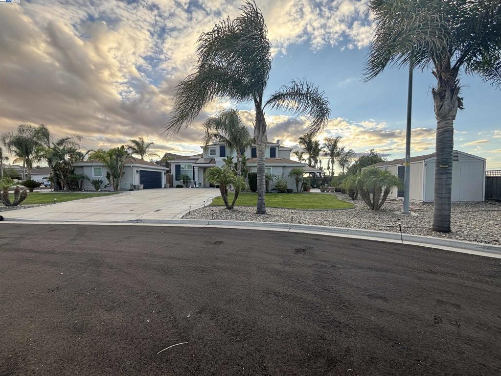 Welcome to the Linne Estates! Nestled in a peaceful .4-acre lot cul-de-sac, 5 bed 3.5 bath 3,590sqft and short drive from Hwy 580/5, local shops, restaurants, and close to Jefferson school. As you step inside, you will be greeted with spacious open-air-floor plans, high ceilings, a gorgeous chandelier & a large tile entry. Conveniently, the in-law Jr suite with full bedroom/bath downstairs, plenty of spacious rooms can be used for workout, home office, entertainment or private dining area. The kitchen features granite countertops, stainless-steel appliances, designated laundry with washer and dryer hookup. Generously sized master bedroom suite features a spacious bathroom and his/her custom walk-in closets, Side gated access is perfect for your RV/boat access, Solar owned, EV charger port in garage, pool/spa & surrounded by beautiful palm trees.