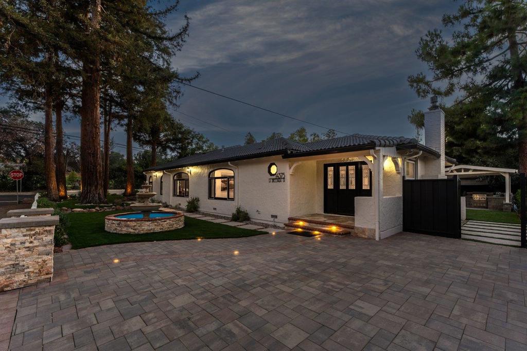 This wonderful one level Mediterranean home is situated right across from the Golf Course. Open floor plan with an updated kitchen /great room. White shaker cabinets, quartz countertops, new S/S appliances, built-in oven/microwave, sub-zero, Wolf 5 burner gas cooktop. Spacious center island with vegetable sink. Pull out drawers & pantry. Great room with a gas fireplace. Separate formal dining room. New 1/2 bath. 4 bedrooms, primary with high ceilings, walk-in closet, romantic master bath, double sinks, stall shower, jetted tub and stone surfaces. Remodeled hall bath with stall shower. New carpets in bedrooms. 4Th bedroom /office with custom built-ins. New light fixtures & recessed lights. Surround sound speakers, crown moulding, hardwood floors, custom window coverings, skylights, closets with built-ins. Double pane windows, french door & slider. Inside laundry with built-in cabinets, gas or electric dryer. 2 car oversized garage with built-in cabinets, car charger, 2 car driveway + 2nd 2 car driveway. Fresh front & backyard landscaping. New pergola w/ outdoor kitchen, 2 outdoor water features, outdoor fireplace. Large Kentucky blue stone patio for al-fresco dining. Exterior landscape lighting. Artificial grass, redwoods & mature trees. Marshal Lane, Rolling Hills, Westmont HS