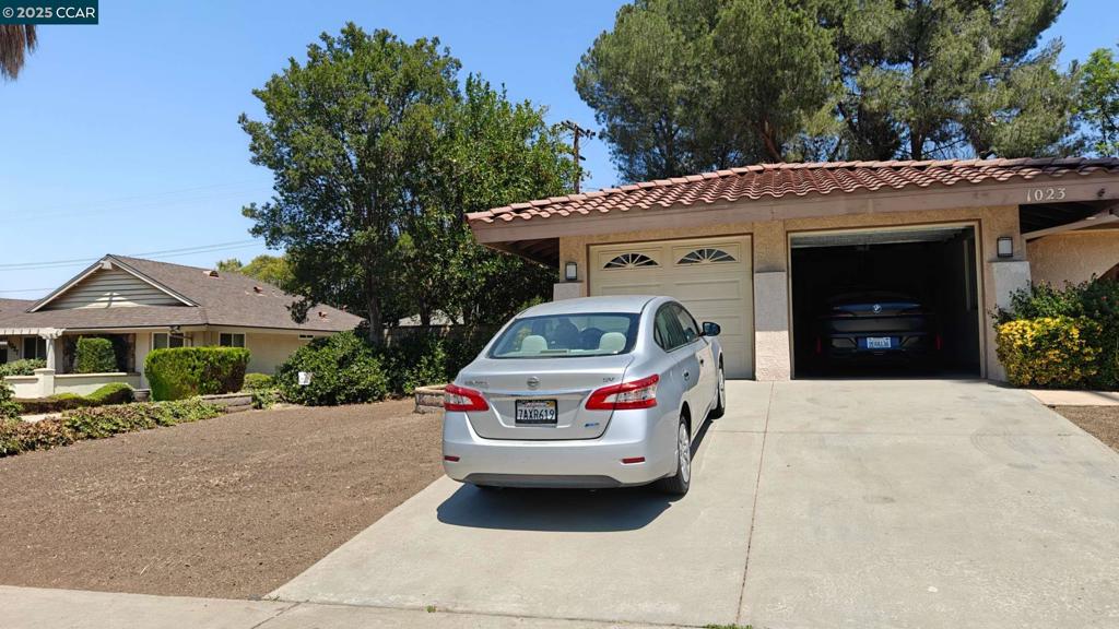 Welcome to your new sanctuary! This 4 bedroooms, 2 bath Spanish revival style inspired home offers a bright and airy open floor plan perfect for gatherings. This home features newly renovated floors in addition to a new stove top, new range, new dish wash, new microwave, new modern celling fans, and new painting. There are two garage door and plenty of driveway access. The kitchen presents a fabulous granite countertop with lots of kitchen storage. Enjoy calm mornings in the spaciuos living room with natural sunlight sponsored by the slinding glass door leading into side yard. The backyard features a lovely quaint pool. great place to cool off and ideal for the hot days. Conveniently located near several parks, UC riverside and Canyon Crest town.