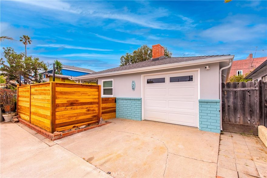 Located just six houses from the sand, this cozy coastal getaway sits in one of the best locations on Silver Strand Beach. Thoughtfully redesigned and completely renovated from top to bottom, this 3-bedroom, 2-bathroom bungalow blends modern comfort with coastal beachside charm. From the moment you step inside, you're greeted by a bright open-concept layout, stunning LVP flooring, and a show-stopping kitchen featuring a huge center island, quartz countertops, and sleek stainless steel appliances. Every inch of this home has been curated with care no detail overlooked. Both bathrooms shine with breathtaking design and modern convenience, creating a spa-like experience at home. The list of upgrades include; New roof, New plumbing, New electrical, New electrical panel, New tankless water heater, New dual pane vinyl windows, New recessed lighting, New ceiling fans, New LVP flooring, New kitchen, New appliances, New bathrooms, Epoxy garage floor, New solid core interior doors, New exterior doors, New courtyard fencing, New and upgraded front courtyard pavers, New backyard hardscape with pavers, deck and drains, New garage door, New rain gutters, Wired for HVAC, Wired for spa, Prewired for vehicle charging station. As you can see everything is new from top to bottom, offering a turn-key experience perfect as a personal getaway, vacation rental, or dreamy full-time beach home. Kick off your flip flops and relax!