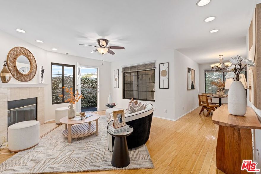 Experience the best of Los Angeles living in this bright and stylish townhome-style condo, ideally located near Beverly Center and The Grove. This spacious 2-bedroom, 3-bath home features high ceilings, abundant natural light, and a seamless blend of comfort and modern design  all complemented by stunning city and hillside views.   Enjoy your private rooftop deck with panoramic Hollywood Hills vistas  the perfect spot to relax, entertain, or take in the beautiful morning and sunset skyline. The primary bedroom also overlooks the Hollywood Hills, offering a peaceful retreat at any time of day.Recent upgrades include stainless steel appliances (refrigerator, oven, dishwasher, washer & dryer).   The home also features secured entry, two-car parking, central A/C, and convenient direct entry from both the garage and front entrance. The well-maintained, gated community is quiet and secure, offering guest parking and comprehensive HOA coverage  all with a reasonable monthly fee. Just steps from trendy cafes, restaurants, and boutique shops, and minutes to West Hollywood and Beverly Hills, this home perfectly combines style, comfort, and prime location  ready for you to move right in!