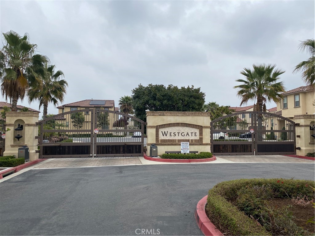 This beautiful home, built by Christopher Homes and feeling nearly brand new, is set in a phenomenal and quiet interior location within the highly sought-after gated community of Westgate. Offering over 1,700 square feet of living space, the floor plan features 3 spacious bedrooms and 2.5 bathrooms. The open concept design highlights a gourmet granite kitchen that flows into the living area. Enjoy a large center prep island with seating, a sunny breakfast nook, white shaker-style cabinets, and upgraded stainless steel appliances including a gas range, microwave, dishwasher, and refrigerator. Thoughtful upgrades can be found throughout, including engineered hardwood flooring, custom bathroom tile, premium carpet, Ultra Premium Dunn Edwards paint, Moen faucets and GWWD windows and sliding door. The large primary suite includes a spa-like bathroom with dual sinks and a spacious closet. Upstairs, a convenient laundry room adds functionality with washer and dryer included. The home has water softener installed for the entire house. The private backyard features new shaded canopy and low-maintenance surrounding vegetation. Built less than 10 years ago, the home sits in one of the best spots in the community on the border of Huntington Beach and Westminster. The area is close to freeways, dining, shopping, and entertainment, and falls within the highly regarded Huntington Beach High School District.