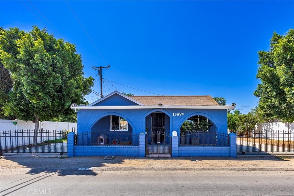If you're looking for your first home or considering the purchase of an investment property that is located close to town but with a quiet neighborhood feel; this two bedroom, one and a half bathroom home is the place! It's the little additions that make this house so special. Like the whole house water softening system and the water purification system under the kitchen sink for your cooking and drinking pleasure. Gates on both sides of the home allowing for plenty of off street parking for family and friends. Fencing on both sides of the yard with a block wall on the back side of the yard. A variety of fruit producing trees are planted around the home including guava, lemon, orange and peach! Looking for extra storage? This home has an "out" building and a storage shed as well as an enclosed laundry room area. Worried about the rising cost of utility bills? The paid for solar panels will put your mind and your wallet at ease! Easy access to the 91 and 15 freeways!