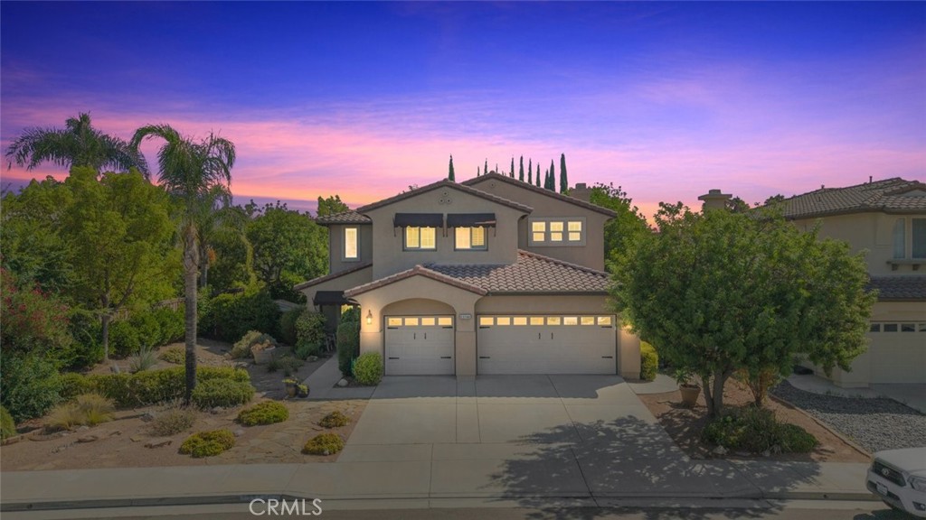 Welcome to this stunning 4-bedroom, 3-bath home with a spacious bonus room, 3-car garage, LOW TAXES, and the freedom of NO HOA. Perfectly situated in a quiet, established neighborhood, this residence immediately charms with its beautiful curb appeal, low-maintenance landscaping, and a quaint front porch—ideal for morning coffee—enhanced by an extended awning for shade. Through the double entry doors, you’re greeted by soaring two-story ceilings, abundant natural light, and an elegant white wood shiplap accent wall along the staircase, setting the tone for the home’s stylish interior. The formal dining room is a showpiece, with high second-story windows, upgraded French doors, a ceiling fan, and direct access to the backyard patio, filling the space with sunshine and fresh breezes. The expansive kitchen will delight any chef, boasting a center island, tile granite countertops, upgraded stainless appliances, a pantry, bar seating, and generous cabinetry. A cozy breakfast nook sits beside a large sliding glass door, seamlessly blending indoor and outdoor living. The inviting family room features a stacked-stone fireplace and ceiling fan, perfect for relaxed evenings. A well-appointed main floor guest bedroom and full bath provide comfort and privacy, while the large laundry room—with ample cabinetry, a utility sink, and side yard access—adds convenience. Upstairs, guest bedrooms are generously sized, with the hall bath offering dual sinks and a shower/tub combo. Matching upgraded vinyl flooring flows throughout, complemented by plush carpet in the bedrooms. The luxurious primary suite offers a peaceful retreat with a walk-in closet, soaking tub, walk-in shower, and dual vanities. The backyard is a private oasis, featuring a multi-height Alumawood patio cover, built-in BBQ with bar seating, lush landscaping, mature trees, and whimsical garden touches. Unwind in the gazebo-covered above-ground jacuzzi, enjoy the side yard astro turf with seating, or make use of additional garden space. Plantation shutters, a dual AC split system, and abundant storage—including a deep under-stairs closet—complete this exceptional property. Centrally located just minutes from the I-15, shopping, dining, entertainment, and the charm of Old Town Murrieta, and within the highly rated Murrieta Unified School District, this home blends comfort, style, and convenience in one perfect package. Don't wait schedule your showing today!
