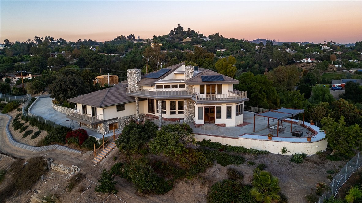 Welcome to your new estate with panoramic 180+ degree views overlooking Los Angeles & Orange County out to Catalina Island. Watch the sun both rise & set from the outdoor patio and balcony spaces. 5 bedrooms, 3 full bathrooms, library, office, wine room, lower level dance studio & 4 fireplaces. Two master suites, one on the main level. More than 5000 square feet of opulence, completely renovated in 2000. Soaring ceilings and open floor plan. 1.5 acres of well landscaped, easy to maintain property, fully fenced with avocado and fruit trees. Less than 25 miles to downtown Los Angeles, convenient to all major freeways. Energy efficient home with newer LG solar panels (2022). Convenient location, quick 1.5 mile drive to Whittwood Town Center, Vons, and many other shops/restaurants. The City of La Habra Heights is known for its spacious luxury properties and lush hillside landscapes. It is also home to the private Hacienda Golf Club.