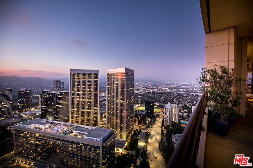 Hovering above the city like a floating palace is Penthouse 40, the "Mansion in the Sky" that occupies the entire 40th floor of the exclusive Century building. The sprawling interior has been transformed by noted interior designer LM Pagano into a stunning palette of textures & colors that are both contemporary & classic, comprising a bold statement worthy of the most discerning buyer. The custom interior features 4 bedrooms, a grand living room & a seductively plush screening room. The master suite defies description with premier views, a seating area with a fireplace, dual baths & expansive closets. Four massive terraces provide an abundance of outdoor space while 360-degree views mesmerize at all times of the day & night with a glorious symphony of light & landmarks from the downtown skyline to the ocean.