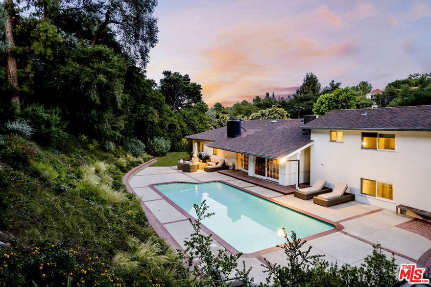 Home was remodeled throughout. (pictures do not reflect some of changes/upgrades) New kitchen cabinets and counter tops, recessed lighting and new floors. Ranch style home located in the highly sought-after Encino Hills. Situated on an expansive nearly 19,000 square foot lot, this mostly single-story charmer features over 3226 square feet of living space, 4 bedrooms and 3 bathrooms with an open and bright floor plan, high ceilings, an expansive living room, dining area and a second seating area. Kitchen features a double oven, ample storage space and an adjacent breakfast nook. A generously sized bonus room upstairs perfect for a home office, game/media room, gym or additional guest suite. All bathrooms are perfectly remodeled with rustic stone counters, tile flooring and designer like finishes. Exit through one of two sliding feature doors into a huge entertainer's backyard with patio and pool. The home is nestled amid many fruit, Oak and Maple trees and lush landscaping. Prime south of the boulevard location, easy West Side access, Award winning, highly coveted, Lanai Elementary School. Close to many fine shops and restaurants.