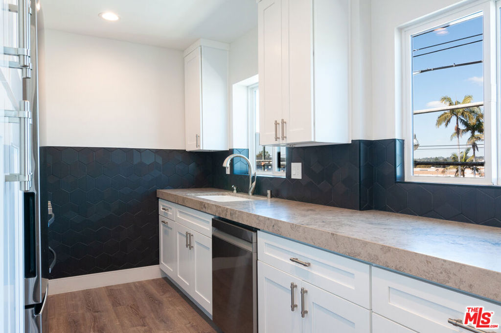 Fully remodeled 2 bedroom 1 bathroom apartment available, located 1.8 miles from Downtown Fullerton and 2.4 miles from Fullerton College. Property features brand new stainless steel LG appliances, air conditioning and heating throughout the entire apartment, and brand new vinyl flooring. The unit also features an exceptional fully tiled bathroom with both floor and wall tile, combined with a walk-in shower for a truly peaceful spa like experience. The spacious galley kitchen has designer Quartz countertops from Bedrosians, a gas LG range, dishwasher, refrigerator and freezer, and offers ample area for storage, cooking, and counter space. The unit has been meticulously remodeled, and no expense was spared to make sure that it is completely up to 2025 living standards. Fully remodeled epoxy floor spacious 2 car garage also available for an additional $400 per month.