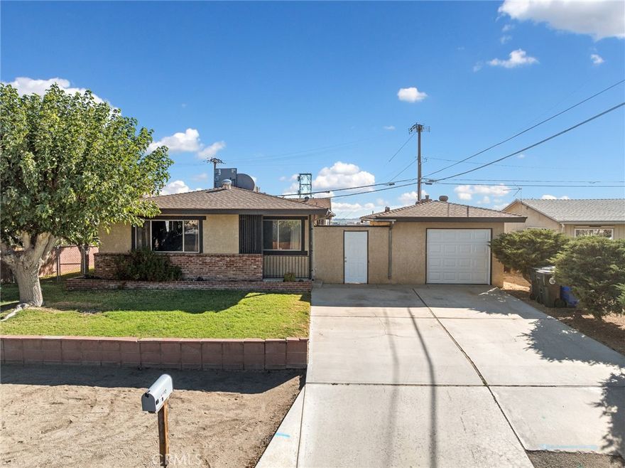 WELCOME HOME!!  This charming 3 bedroom/2 bath home blends comfort and functionality!  Nestled on a spacious corner lot, this inviting residence features an open floor plan with abundant natural light, creating a warm and welcoming atmosphere throughout.  Recently updated with NEW CARPET, NEW STOVE, and FRESHLY PAINTED THROUGHOUT.   Also has NEWER ROOF and A/C Unit.   Sizable living room with a cozy WOOD BURNING STOVE - perfect for everyday living and entertaining.  ADDING EVEN MORE VALUE AND VERSATILITY IS AN ADU (Accessory Dwelling Unit) approximately 400 sq ft. - ideal for extended family, guests or possible rental income potential.  This separate unit offers endless possibilities!    A generous sized back yard includes expansive concrete area with PLENTY OF ROOM FOR YOUR RV OR BOAT.  The property includes a single car garage in front of the house and ALSO an ADDITIONAL OVERSIZED 2-CAR GARAGE with its own access at the north side of the property.   With its thoughtful layout and charming details - this home is a rare find!  Schedule your viewing today - Don't miss out your opportunity to own this turn-key home!