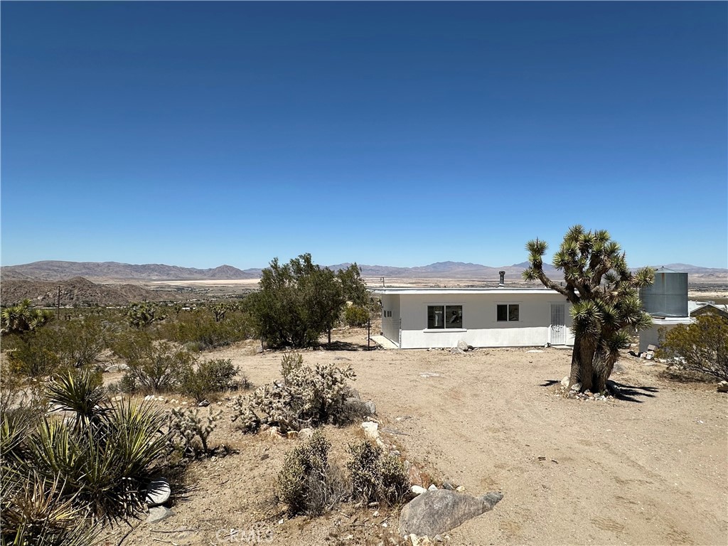 Studio cabin with incredible views. Complete new septic system. Tiny home living with all of the comforts and privacy for full time or vacation enjoyment. Updated cabin has new windows, new kitchen, new siding. All electric home, small fenced area, shed. The 5 acre parcel has tons of Joshua Trees, rocks, and desert plants. There is a wood stove and a new combo a/c and heating unit. Windows all along the north side of the cabin give views of Lucerne Valley. Views to the south are of the back side of the Big Bear mountains. Property uses hauled water and there is a tank on the property. Most vehicles can access but road is dirt and a high clearance vehicle is recommended. Less than 1/2 mile from pavement. Head up the hill to nearby forest service roads that allow off road vehicles. There are also dirt roads that go through Holcomb Valley and Fawnskin from this side of the mountains. Drive to Big Bear in about 30 minutes (the back way) up Highway 18. Get away and still be close to shopping and restaurants in the friendly small town of Lucerne Valley.