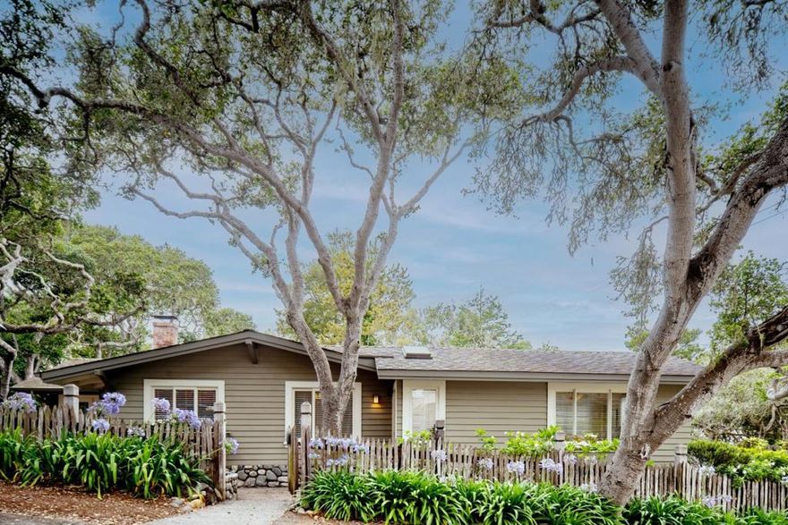 Nestled in the heart of Carmel-by-the-Sea, McChesney House is a storybook single-level cottage that perfectly captures the essence of coastal living. Thoughtfully renovated in 2010 to preserve its timeless charm, this enchanting home features open-beam vaulted ceilings, skylights, a cozy window seat, charming flower boxes, and signature river rock accents throughout. Just a short stroll to both the white sand of Carmel Beach and town, the location offers the best of Carmel living. Mature oak trees frame the patio and deck, creating a peaceful and private space for outdoor living and entertaining. Inside, you'll find refinished Douglas Fir floors, built-in cabinetry, and a wood-burning fireplace. A single-car garage adds convenience to this idyllic retreat. Whether you're looking for a serene full-time residence or the perfect pied-a -terre, McChesney House is a rare and delightful gem in an unbeatable location!