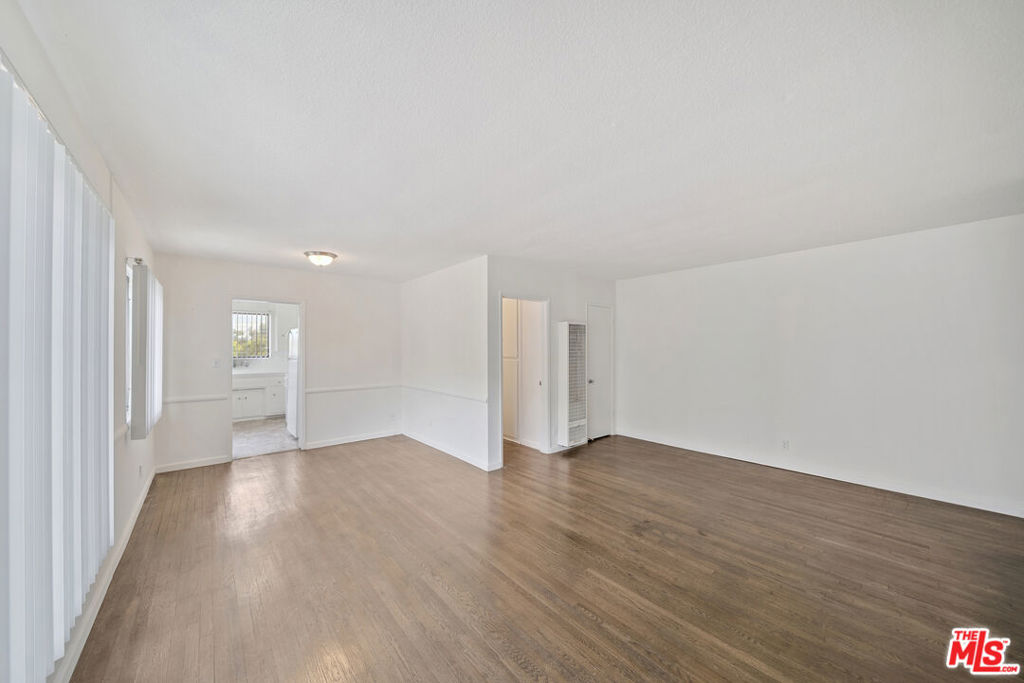 Corner unit. Upstairs unit. Tennat Pays. gas, electric, trash. Included: Water, parking, landcape. On site Laundry. Welcome to your updated, north-facing unit filled with abundant natural light in a quiet, gated building. This spacious unit features separate living and dining areas, with plenty of storage space throughout the living room. Enjoy the updated kitchen equipped with a stove and oven, and beautiful hardwood flooring throughout the home. The large bedroom offers generous storage as well. Parking is included for your convenience, and there's an on-site laundry facility to make life even easier. Don't miss this comfortable and inviting place to call home!