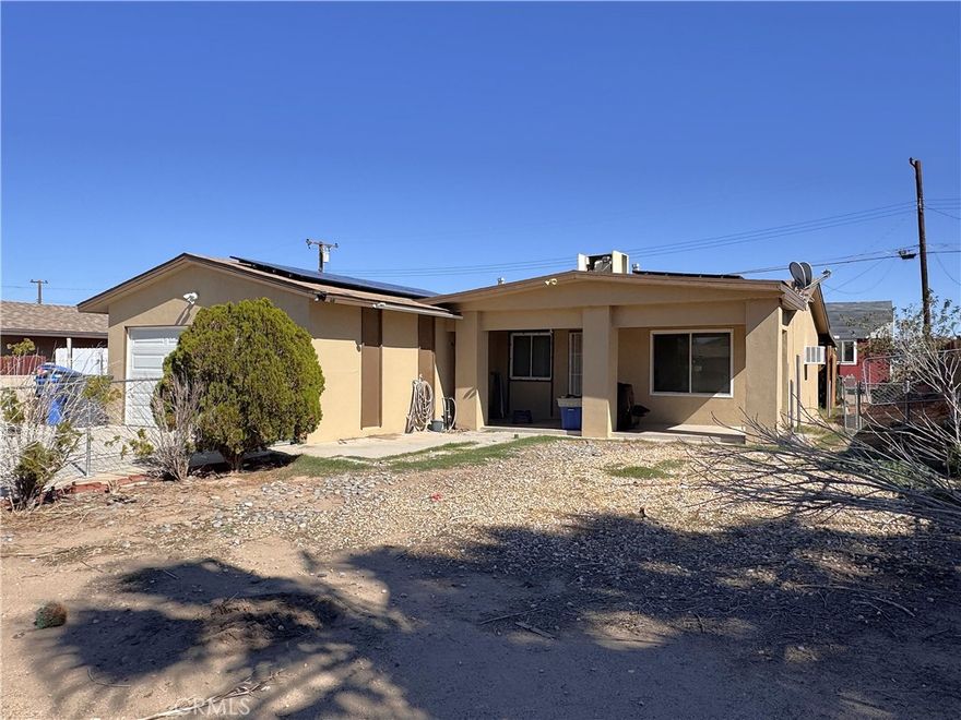 Bring your thinking caps! 3 bedroom 1 bath home with lots and lots of potential. 1,000 square feet of living space, with an attached two car garage, a huge covered patio surrounded by a wood fence plus a chain link fence around the front and back yards. Included in the sale is a large shed in the back yard great for extra storage. The interior of the home needs some extra love.