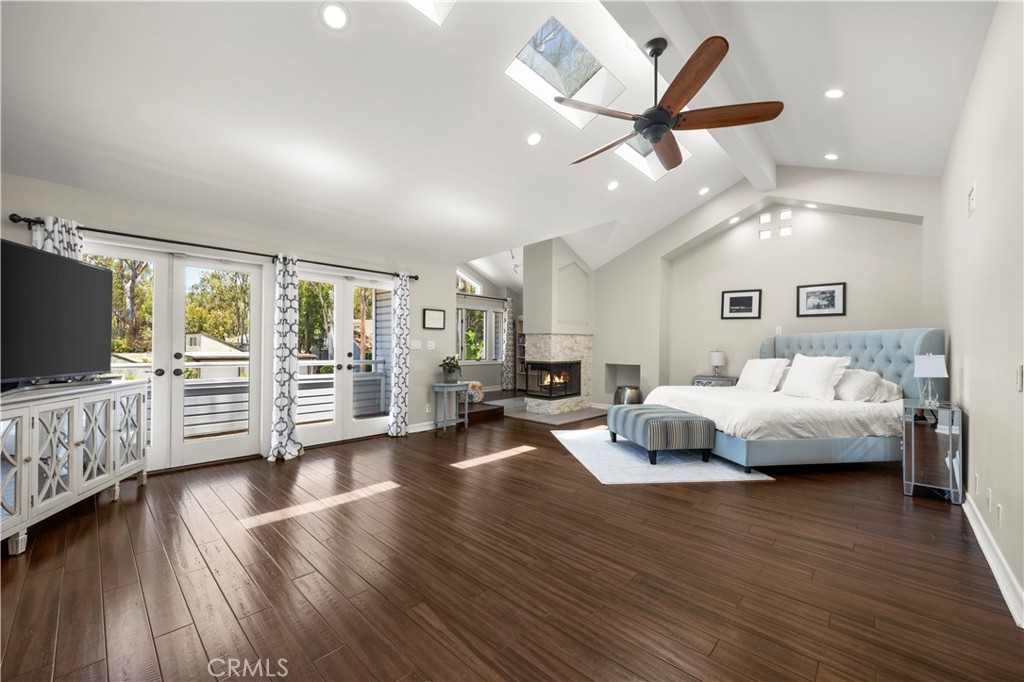 This beautifully updated home in The Woods neighborhood of Lake Forest offers a rare mix of space, character, and peaceful surroundings. It features five bedrooms, three full bathrooms, and a warm, open layout with vaulted ceilings. The main level includes a spacious living area, a gourmet kitchen with a large island and quartz countertops, and a three-car garage with two 220-volt outlets for EV charging. Upstairs, the private primary suite includes a fireplace, balcony, walk-in closet, and a spa-like bathroom with a soaking tub, double vanity, and skylights. The backyard is perfect for relaxing or entertaining, with expansive decks, open space, and wooded views, plus scenic walking trails just beyond the fence. The neighborhood offers the best of both worlds: peaceful, tree-lined streets with parks and trails nearby, along with easy access to shopping and dining. Foothill Ranch Towne Centre, Lake Forest Village, and Irvine Spectrum are just minutes away, with local favorites that make dining out a breeze. Nearby, you’ll find Serrano Creek Trail, which connects to Whiting Ranch for hiking and mountain biking. And when you’re ready for a beach day, the coast is only about 10 miles away. Residents also enjoy access to the Lake Forest Sun & Sail Club with pools, tennis and pickleball courts, a gym, and more. Homes like this in The Woods don’t come around often, so schedule your private tour or stop by the open house before it’s gone!