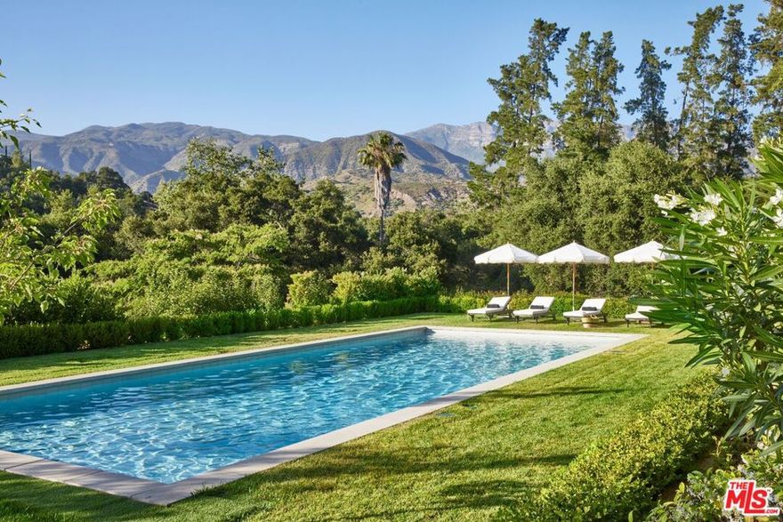 Welcome to Paradise Ranch, a 36.8-acre legacy estate where the beauty of Ojai meets the dream of living well. As you pass through the gates, you're instantly transported to a more intentional way of life, built around meaningful moments that last, in one of California's most coveted destinations. Nestled beneath the majestic Topa Topa Mountains, this rare offering is more than a property; it's a private haven where friends and family gather for long weekends, special occasions, and spontaneous escapes. At the heart of the compound stands an inviting, light-filled farmhouse, surrounded by lush lawns, white roses, lavender, stately cypress, and fruiting citrus, avocado, and olive trees. Sprawling flat fields invite your own flourishing vegetable garden; perfect for farm-to-table meals and weekend harvests. A charming guest house offers an idyllic retreat where loved ones feel at home. Wander to your private saloon, perfect for poker night, game day, or a nightcap. A sweeping heritage-style agricultural barn with an expansive workshop anchors the property with rustic charm and versatility. It's ideal for collectors, creatives, equestrians, or entrepreneurs. Just beyond sits an approximately 2,000-square-foot structure with electric and plumbing rough-ins, ready for whatever you envision: bunkhouse, office, studio, gym, or game room. Dream big, because there's room for it. Meandering trails lead to resort-style amenities, including a stunning pool and spa, a sports court, putting green, limestone fireplace, horseshoe pits, shuffleboard, a large pond with a fishing deck, and a seasonal creek that adds a storybook quality. This estate offers something for everyone. Every space invites connection and makes it hard to say goodbye. Whether you're working the land, savoring the legendary pink moment sunsets, or dining al fresco beneath the stars, the outdoors here isn't just a backdrop; it's an experience. Paradise Ranch is a once-in-a-lifetime opportunity to own an iconic Ojai estate where nature, peace, and privacy meet beauty, adventure, and joyful living. Paradise Ranch is your invitation to live the dream.