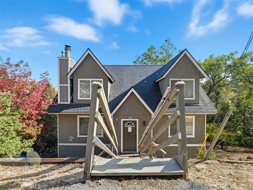This charming Lake Arrowhead mountain retreat offers the perfect blend of rustic elegance and modern comfort, complete with coveted Lake Rights. Spanning approximately 1,660 square feet, this home features 4 bedrooms and 2 bathrooms. The oversized lot provides a sense of privacy and space rarely found in the area, while the home has breathtaking panoramic views of the lake, surrounding mountains, and majestic pine trees. Inside, you’ll find coffered ceilings in the great room. This home is complemented by its remodel around 2014. Whether you’re relaxing by the fire, taking in the serene views from the deck, or enjoying all that Lake Arrowhead has to offer, this home perfectly captures the essence of mountain living with style and comfort.