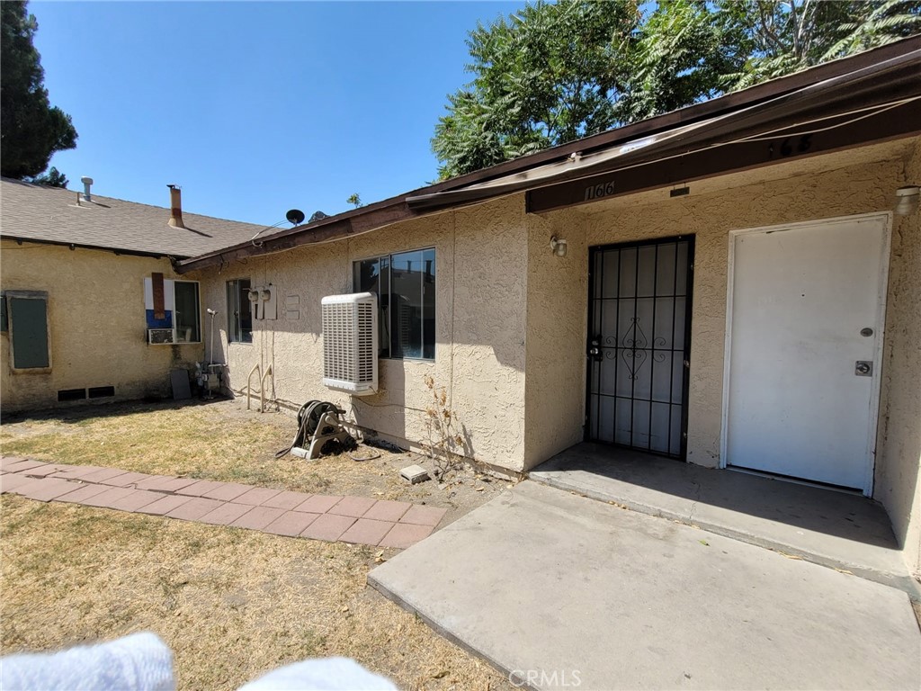 Warm and Cozy 2 bedroom 1 bath unit. Remodeled Kitchen with Stainless Steel Stove and Microwave, New Interior Paint throughout the unit, New vinyl tile floors in the bedrooms, New Shower/tub in bathroom installed 1 year ago. This unit has central air and window swamp cooler. The unit also comes with 1 covered carport space for parking. This end unit is located near shops and restaurants, minutes away from the 215, 210 and 10 freeways Don't miss out seeing this unit it wouldn't be on the market long.