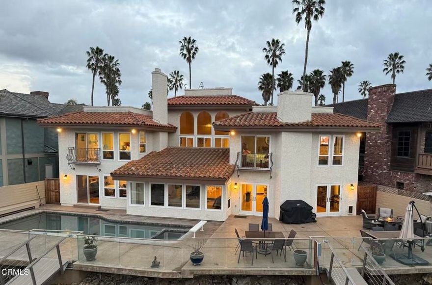 Ventura Keys Waterfront Home with newer 90 ft boat dock. Newer electric 50 amp power at your dock. 80 (+) ft deck with a swimming pool and hot tub incorporated in the pool. Electric powered cover for the pool. Home was built in 1979 and was nicely remodeled. A beautiful view of the water from most rooms. 1 Bedroom downstairs with fireplace and view of the water, remodeled full bath with walk in shower. French doors from dining room leading to the deck area. Fireplace in large dining room and open to the kitchen with granite countertops and top of the line appliances, with large counter for eating or entertaining.  Living room with fireplace and view of the water.Outside area great for BBQ or just sitting enjoying the sunsets. 3 bedrooms and 2 full baths upstairs with jacuzzi tub in the primary, sauna, and a walk in shower with a balcony and view of the water. There are 4 fireplaces , and a 4 CAR GARAGE. Not too many of those in the Ventura Keys. The home and boat dock has a sheltered location with a large turning basin close by. This is the place to be to enjoy Ventura Beach living at its best!!