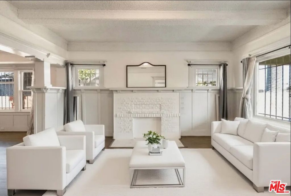 Welcome to this beautifully preserved, vacant and move-in ready duplex nestled in a vibrant Los Angeles neighborhood, just minutes from Exposition Blvd, the Metro, West Adams, and USC Village. This rare property perfectly blends timeless vintage charm with thoughtful upkeep and modern comfort.Featuring two separate residences with private entrances and central air conditioning and heating, this duplex offers exceptional versatility. The spacious front home includes three inviting bedroomsone featuring a convenient Murphy queen side bedtwo full baths, a bright kitchen with breakfast bar, and a flexible bonus space perfect for dining, work, or relaxing. The charming rear unit offers two bedrooms, one bath, an open layout, and a peaceful private backyard ideal for guests, creative projects, or rental income.An attached garage adds convenience and extra flexibility. Whether you're seeking a multi-generational home, a live-and-rent opportunity, or simply a beautiful place to create lasting memories, this well-cared-for vintage duplex is a true gem.Experience the best of LA living where character, care, and location come together to welcome you home. Won't Last!