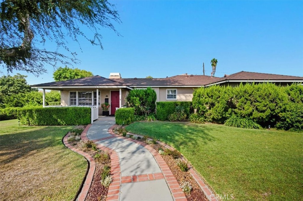 Charming Home on a Corner Lot with Great Curb Appeal.
Welcome to this well-maintained 3-bedroom, 1-bath home situated on a desirable corner lot in a quiet neighborhood. From the moment you arrive, you'll appreciate the charming front porch, lush landscaping, and strong curb appeal.
Inside, the living room is spacious with a fireplace and 2 doors that go to the back patio. The bright and inviting kitchen offers ample space for cooking and gathering, while natural light fills the living areas, creating a warm and welcoming atmosphere. All three bedrooms are well-sized, perfect for family living, guests, or a home office.
Step outside to enjoy the beautifully landscaped backyard featuring a private patio area surrounded by mature plants—ideal for relaxing or entertaining. The oversized 2-car garage provides plenty of room for vehicles, storage, or a workshop.
This home combines comfort, convenience, and character in one appealing package—don’t miss your opportunity to make it yours!
