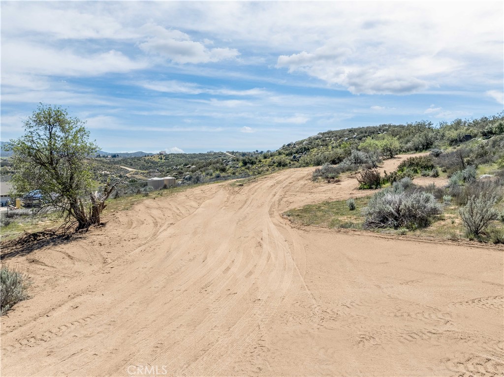 Drive on out to this usable and unique 3.35 acres in private Lake Riverside Estates. Explore the potential building sites, native vegetation, and beautiful rock outcroppings that make this parcel so special. Located at the base of a hill, look out over Lake Riverside and the Anza Valley below and take in the fresh air, dark and starry nights, and pleasant country living that you’re sure to appreciate. Affordable and build-able, this lot is perfect for those seeking their next opportunity. Only 30 minutes from the conveniences of Temecula including its wineries, shopping centers, and restaurants, or just a short 45 minute jaunt to the resorts and golf courses of Palm Desert. Don’t forget to enjoy all the amenities that Lake Riverside Estates has to offer including the 55-acre fishing lake, 3,500’ paved airstrip, equestrian center, pool, picnic cabanas, playgrounds, sports courts, trailheads, maintained roads, private security, and gated entry. Plan a trip out today and experience this land in person.