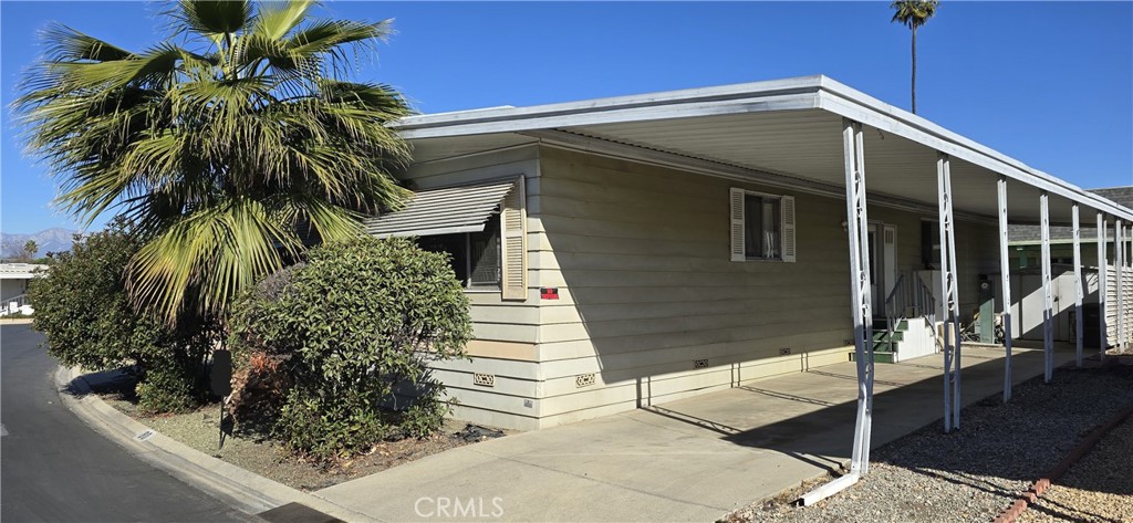 Spacious 2 bedroom, 2 bathroom mobile home in the highly desirable Riverside Country Club mobile home park! Open layout with new laminate flooring throughout most of the 1560 square feet of living space! Features include: Large living room, formal dining room with built in cabinet, spacious kitchen w/gas cooktop, fridge, built in table, and lots of cabinet space! There's also a Den with a bar area and fireplace too! The main bedroom has new laminate flooring, mirrored wardrobe, and a private bathroom 2 sinks & a bathtub! Nice size second bedroom next the 2nd bathroom which has a shower! Other features include indoor laundry with exit to carport, and a covered porch on the other side of the home. Large shed included too which is at the end of the driveway! Roof was recently resealed. Great location in the community with the home backing up to the community Clubhouse which features a gated pool spa, rec area, shuffleboard, horseshoe pit, billiard room, kitchen, and more! There's also a lot for parking RV/Trailers too. Contact park manager with any questions regarding rules/costs of parking RV's in this area.