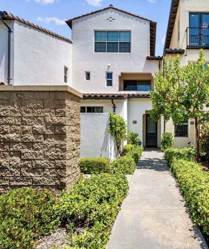 Available on 10/1/2025! WALKING DISTANCE TO SCHOOL! 2 MASTER BEDROOMS + guest bathroom• New paint•New Carpet• EV charger• Welcome to the most popular Modern Luxury Southern California community of Cypress Village in the beautiful City of Irvine• This beautiful unit falls into premier "Zinnia" Collection built by Lennar• This exclusive modern luxury residence features 2 bedrooms and 2.5 bathrooms• This unique floor plan has its ground level all upgraded hardwood flooring entry with access to a 2 car garage which has plenty of storage room• Garage comes with its own EV charger• Living area on the second floor with designer paint is located in the heart of this exclusive unit home which boasts a gourmet kitchen showcasing a medium size island along with all stainless steel appliances such as gas range & oven, built in microwave, refrigerator and dishwasher• Second floor also features a half bathroom which is great for your guests• Third floor offers 2 bright En Suite bedrooms as well as an individual laundry area located in between bedrooms with stackable washer and dryer• Experience and enjoy a bright open floor plan with sliding door access to a private outdoor balcony with view of the city and neighborhood! Approximately 1,171 Sqft of interior indulgence and tasteful living with unique designer paint• This home offers the finest interior elements including hardwood flooring and recessed lightings! Your desired home is waiting for you! Come and enjoy world class amenities exclusive to Cypress Village residents• Parks, pools, barbecue, picnic Areas, dog parks and walking trails all inspired by the warm ambiance of their surrounding environment• Walking distance to schools• Community Features 6 Parks and 3 Pools• Amenities offered: 2 ball fields, 2 softball fields/soccer overlay, 1 full-court basketball, 2 half-court basketball, 3 tennis courts, 1 volleyball, 1 spa, 1 wading pool, 4 tot lots, 11 barbeques, 32 picnic tables, linkage to Jeffrey Open Trail•