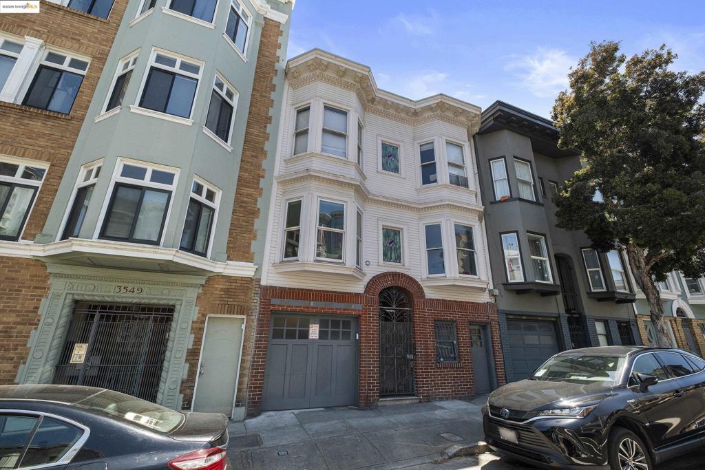 This isn’t your ordinary one-bedroom condo — this one-of-a-kind Mission Dolores home spans two levels, with an exclusive lower floor that delivers unmatched flexibility & potential (and low HOA dues!). This level includes a spacious bonus room—with no shared walls—ideal as a home office, gym, or media lounge. 2 storage areas (incl. private laundry) add valuable functionality, and an attached garage with upgraded 220V power makes EV charging possible. Approved plans (buyer to verify) allow for conversion of this level into a finished living space with an added bedroom and bath. The main level offers an inviting living space enhanced by custom built-ins and streamlined cabinetry. The front-facing bedroom features a cozy bay window bench—perfect for relaxing with a book or soaking in the sun. The updated bathroom showcases a sleek, modern design, with a wide vanity mirror, modern lighting, and a generous walk-in shower. The kitchen offers SS appliances, ample cabinetry, and wraparound counters that flow into a vibrant dining space. Just steps from Dolores Park in the heart of SF's historic birthplace—this home offers the ultimate city lifestyle: walkable streets, the best city weather, world-class dining, artisan cafés, BART/Muni access, and a vibrant, culturally rich community.