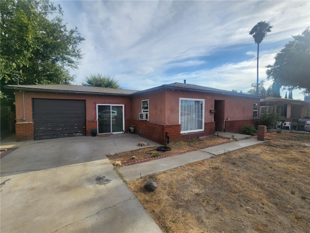 Welcome to a hidden gem in Fontana brimming with potential! This charming property boasts original hardwood flooring throughout the bedrooms, living room, and dining areas, exuding classic character and warmth. Stay cool and comfortable with wall AC units installed in every room, ensuring a refreshing escape during warmer days. You'll find a fantastic bonus room, constructed just a year ago, perfect for additional living quarters, a guest suite, or even a home office. This versatile space features its own cozy bedroom with a closet, a ceiling fan, and a separate bathroom complete with a stylish stand-up shower. The convenience continues with a laundry room right in the garage, making chores a breeze. The kitchen showcases durable linoleum tile and comes with the stove included, making your culinary adventures easier than ever. Ceiling fans throughout the home add an airy feel and help circulate that cool air. But the highlights don’t stop there! The spacious backyard is an entertainer's dream, featuring a built-in barbecue pit perfect for gatherings and summer cookouts. With so much potential, there’s ample room for a pool or the possibility of building an ADU (Accessory Dwelling Unit). Hurry this gem won't last! Whether you’re seeking a cozy family home or an investment opportunity, this Fontana property is brimming with opportunities to make it your own. Don’t miss out on your chance to see this versatile space!
