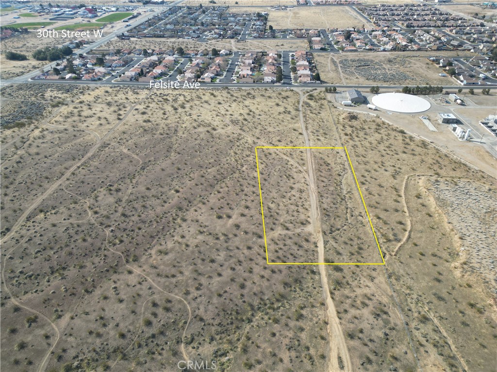 Seller financing avaliable! A piece of land with approx 54,450 square feet or 1.25 acres is now avaliable for sale in the city of Rosamond, California. The lot is zoned residential, but buyer to confirm with the city of Rosamond to verify what exactly can be built on the lot. The land is within a five minute drive of hwy 14 which provides an easy commute to the neighboring cities such as Lancaster and Palmdale. This lot is also within a three minute drive to Rosamond High School and Hamilton Elementary School.