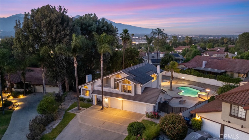 Welcome to the One You’ve Been Waiting For!
Tucked away on a hilltop at the end of a quiet cul-de-sac in the prestigious gated community of Mountain Meadows, this stunningly remodeled 4-bedroom, 3-bathroom retreat on one of the largest lot offers everything you’ve been dreaming of—and more.
Step inside and be greeted by soaring vaulted ceilings, formal living room with a brick fireplace, and a formal dining space perfect for gatherings. The open-concept kitchen features granite countertops, a built-in range, double stainless steel ovens, and a breakfast bar that spills over to the family room with a second fireplace plus a stylish wet bar ready for your next celebration.
Let’s enter the backyard, your very own private oasis through charming French doors-complete with a sparkling in-ground swimming pool and invigorating spa, spacious patio ideal for entertaining under the stars. Need more room to relax or host? Enjoy the fully permitted enclosed patio.
The versatile floor plan includes a convenient downstairs bedroom and full bath—ideal for guests or multigenerational living. Upstairs, the expansive primary suite offers a walk-in closet, serene private balcony, and an abundance of natural light exuding from the skylights.
Additional highlights include a wide staircase, ceiling fans throughout, a relatively newer roof (about 8years old) as well as a relatively newer money-saving paid-off Tesla solar system, valued at $50,000.
This isn’t just a home—it’s a lifestyle. And it’s ready to welcome you, your friends and family