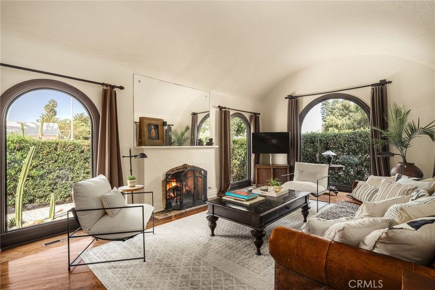 Welcome to 2800 Hillcrest Drive, a stunning Spanish-style residence nestled in the heart of West Adams, one of Los Angeles' most dynamic and culturally rich neighborhoods. This Spanish revival home seamlessly combines historic character with modern upgrades, offering timeless charm and everyday comfort and privacy on all sides . The living room features a soaring domed ceiling, dramatic arched windows, and a gas/wood-burning fireplace, creating an impressive focal point for the home and those cozy winter nights . Hardwood floors flow throughout, leading to the gourmet kitchen with gorgeous rich cabinetry, granite countertops, high end appliances such as a La Cornue stove, Miele dishwasher, and built-in SubZero refrigerator. A bright breakfast nook with a vaulted torret ceiling adds architectural flair, while three spacious bedrooms and a remodeled main bathroom with dual sinks, custom vanity, and an open-concept spa-style shower offers comfort and style. The 2 covered patios create an inviting indoor /outdoor living space. Set on a generous corner lot with R3 zoning, this property presents versatile potential for future expansion-Envision a garage, ADU, or duplex (buyer to verify). The property is fully enclosed and designed for privacy, creating a serene outdoor retreat ideal for relaxing or entertaining. Enjoy the convenience of West Adams living with nearby dining at Cento Pasta Bar, Highly Likely Cafe, and the brand-new Michelin-starred Maydan Market food hall- a foodies paradise. The location also offers quick access to Whole Foods, Culver City, major freeways, and the beach is 8 miles away on the 10 freeway