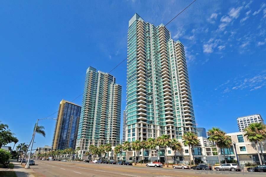 GRAND SOUTH ! Truly one of the finest addresses to call home Downtown. Very spacious 1 bedroom 1 and 1/2 bath, 2 huge patios, over-sized parking space large enough for auto and golf cart or? Very rare floor plan (only 2 exist) with approximately 1,100 square feet located facing West (great natural light) with peek views of harbor. The Grande has all the amenities one would be looking for, lap pool located on South side of building (great sunlight all day), spa, steam room, sauna, fabulous fitness center, fire pits, BBQ area, 24 hour security, concierge, quest suite, 4 elevators (not much wait time) community room for private parties equipped with full kitchen, TV, beautifully furnished. Life at The Grande is the finest living in San Diego