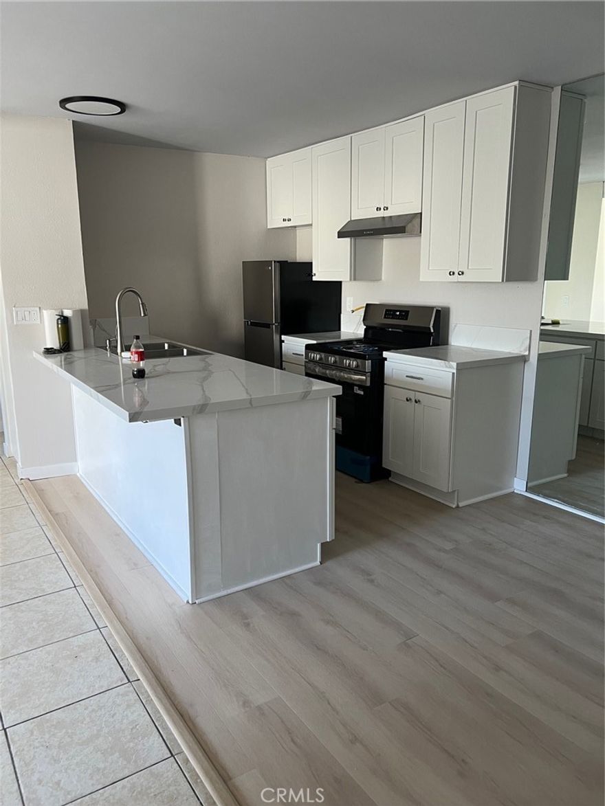 Beautiful and modern. Check out this condo that has high ceilings, spacious bedroom, walk-in closet, brand new kitchen, brand-new stainless-steel appliances, new floors, new paint, new light fixtures, new bathroom, and so much more. Not only does the unit have its own patio area but you also get access to a swimming pool, jacuzzi, rec room, tennis courts, an assigned parking, and a gym. Look no more, this condo is ready to be your HOME! **THIS IS AN UPSTAIRS UNIT**