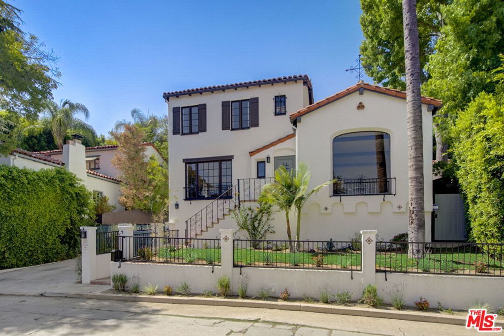 Magnificent 4 bedroom / 4 bath Spanish Revival pool home North of Los Feliz Blvd. and close to Griffith Park trailheads has been meticulously restored to offer all the modern conveniences while preserving historical details, including a Batchelder tile fireplace, exposed hand-painted wooden beams, and authentic ironwork and magnesite stairs. Modern upgrades include Sonos music system, 4 camera security system, an automatic gate and garage door that can be remotely controlled, and Nest thermostat. The sparkling salt-water pool & hot tub were added in 2020 and are surrounded by lush green outlooks and beautiful architecture. The hand-painted Talavera tile at the waterline and on the stairs near the pool and the private gardens add to the ambiance. The locking automatic safety cover keeps the pool warm and people and pets safe. Enjoy a relaxing swim because the pool equipment is in the garage - no noise around the pool! Turn on the hot tub on the way home from your phone for immediate relaxation. Los Feliz, Atwater Village and Silver Lake shops and restaurants are all close by as is the Greek Theater. Other features of this home include a light-filled primary suite with spa-like bathroom and two walk-in closets, both a formal living and dining room, and a basement that is perfect for a home office and den. Parking is easy with a detached 2-car garage with 220v behind an automated gate, Comfortable modern convenience while maintaining the scale, beauty, and nostalgia of old Hollywood, this is a truly special home that you won't want to miss.