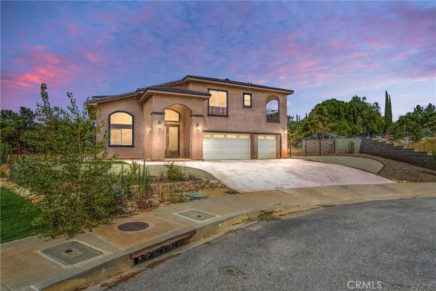 Welcome to the brand-new luxury homes at Brookwood Ct, nestled off Wildwood Canyon and Holmes St. Just 4 minutes from Yucaipa Equestrian Center and Wildwood Canyon State Park, this development is among the finest in all of Yucaipa. Upon entering, you'll be greeted by stunning iron doors, leading you into a thoughtfully designed space with high ceilings and an open, welcoming floor plan. Every detail has been meticulously crafted, featuring high-end materials, and designs, including accented iron balconies and a grand staircase. The masterpiece kitchen is a chef's dream, perfect for entertaining and daily living. The main floor includes a luxurious master guest room, while upstairs, a spacious loft area offers additional living space. The beautiful primary bedroom boasts a double sink and jacuzzi, providing a serene retreat. Three additional spacious bedrooms share balconies with breathtaking views that stretch for miles. This home also includes a fully paid-off solar system, ensuring energy efficiency. The expansive backyard offers ample space to create your own resort-style oasis. Situated in a private cul-de-sac, these homes offer both privacy and convenience, with proximity to equestrian facilities, state parks, and all the amenities Yucaipa has to offer. Don't miss this opportunity to own a piece of luxury in one of Yucaipa's most prestigious neighborhoods.