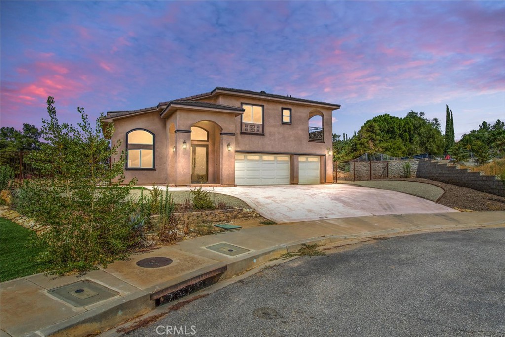 Welcome to the brand-new luxury homes at Brookwood Ct, nestled off Wildwood Canyon and Holmes St. Just 4 minutes from Yucaipa Equestrian Center and Wildwood Canyon State Park, this development is among the finest in all of Yucaipa. Upon entering, you'll be greeted by stunning iron doors, leading you into a thoughtfully designed space with high ceilings and an open, welcoming floor plan. Every detail has been meticulously crafted, featuring high-end materials, and designs, including accented iron balconies and a grand staircase. The masterpiece kitchen is a chef's dream, perfect for entertaining and daily living. The main floor includes a luxurious master guest room, while upstairs, a spacious loft area offers additional living space. The beautiful primary bedroom boasts a double sink and jacuzzi, providing a serene retreat. Three additional spacious bedrooms share balconies with breathtaking views that stretch for miles. This home also includes a fully paid-off solar system, ensuring energy efficiency. The expansive backyard offers ample space to create your own resort-style oasis. Situated in a private cul-de-sac, these homes offer both privacy and convenience, with proximity to equestrian facilities, state parks, and all the amenities Yucaipa has to offer. Don't miss this opportunity to own a piece of luxury in one of Yucaipa's most prestigious neighborhoods.