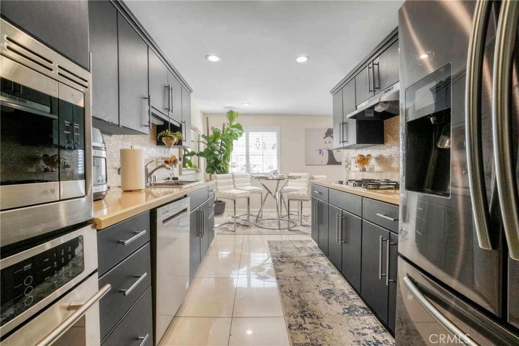 Stunning and spacious tribute-level townhome in the heart of Tarzana, offering 3 bedrooms and 2.5 baths, and over 2200 SQF of beautifully upgraded living space. Enjoy gleaming hardwood floors, elegant granite countertops, and abundant natural light throughout. The versatile bonus room is perfect as a home office, gym, or media space or playroom. Direct -access 2 car garage and private gated entry provide comfort and security. All just moments from Ventura Blvd wit great shops and dining. DO NOT MISS THIS ONE...