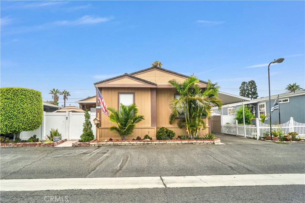Location! Location! Location! Beautiful and Spacious Mobile Home For Sale! Triplewide, Featuring 3 Bedrooms and 2 Bathrooms, Built in 1994 and First Sold in 1996, The house welcomes you to the Open Floorplan with Cathedral Ceiling in the living room, Skylight in Living Room. Updated Kitchen with granite countertops. The Dining Area is located off the kitchen, Enjoy family gatherings in the cozy family room that has a chimney for the cold weather. The Primary bedroom is located on one side of the house featuring 2 walk in closets, There is an extra room in the Primary Bedroom currently being used as an office. The Primary Bathroom has double vanity sinks with granite countertops, bathtub and shower. The other two rooms are located on the other side of the house. Ceiling fans in dining area, family room and Primary Bedrooms. New AC unit. Rare opportunity to own a mobile home with a front patio. You can go out to relax and enjoy the afternoons while the sun sets. Vinyl Fence on Mobile Home Space for privacy. The community features a clubhouse, pool and jacuzzi for those hot summer days! This Mobile Home is located just minutes from fine dining, shopping, garden walk, Disneyland and freeways! Don't let this one go by! You have the opportunity to call it home.