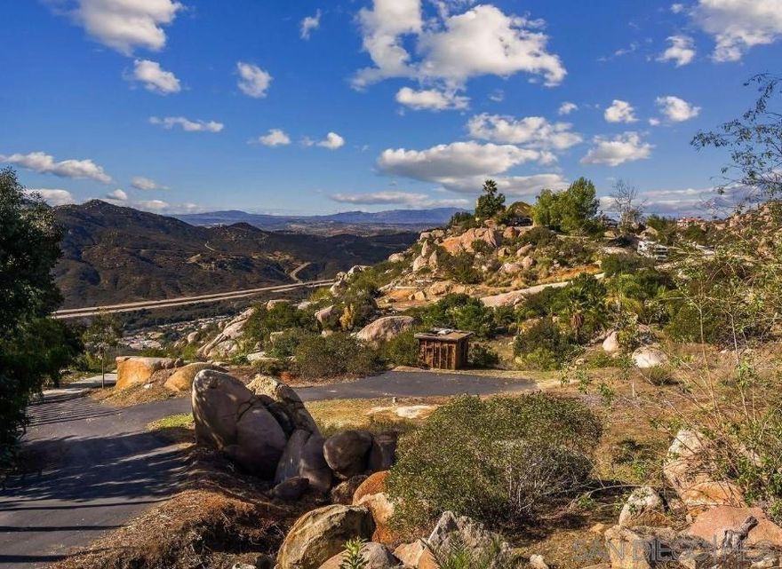 Fantastic Opportunity to own a ready-to-build parcel with panoramic views and key infrastructure already in place! Utilities include metered water! nearby SDG&E power transformers! sewer connection is optional (or approved septic)! Fiber internet is available! Driveway is substantially completed with grading and topo maps! House and grading plans have already been submitted to the county, with fees paid and comments available for buyer review! Making the permitting path faster and smoother!  Formerly part of an avocado farm! The land offers fertile soil, natural rock features and a private yet accessible setting!