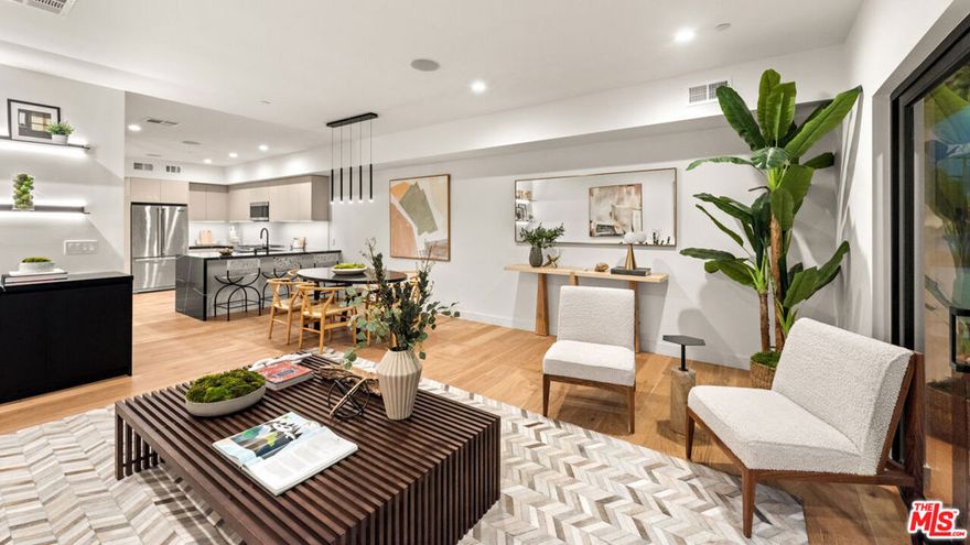 Experience modern LA living at its finest! This light-filled and newly built 4-bedroom, 4.5-bath home features 2,578 square feet across 4 floors, blending comfort, convenience, and style all within a secure, gated community. The open concept kitchen is highlighted by Viking appliances and a designer bar perfect for entertaining. Retreat to the sunlit primary suite featuring 2 walk-in closets and a luxurious ensuite bathroom. Off the top floor loft, there is a private deck with stunning views and a grill for year-round enjoyment. Other amenities include solar panels for reduced electric bills, an EV charger in the attached 2-car garage, a dedicated laundry room, and central air and heat with individual floor zones. Enjoy an easy commute to Culver City, Santa Monica, and Playa Vista, or a short trip to trending restaurants in West Adams. Flexible lease terms and fully furnished options available. Inquire today!