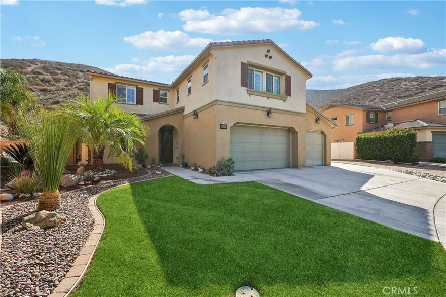 Welcome to 36274 Waxen Way, an exceptional multi-generational “Gen-Suite” home in the highly desirable Canyon Hills community of Lake Elsinore. Filled with an abundance of natural light, this beautifully upgraded residence combines modern living, versatile spaces, and a resort-style backyard on a spacious lot with no rear neighbors, offering privacy and serene hillside views. The open-concept interior is bright and inviting, with a spacious living room flowing seamlessly into a modern, upgraded kitchen with ample counter space and a flexible dining area—perfect for daily living or entertaining. The main-level gen-suite features a private entrance, kitchenette, living room, full bathroom, and laundry hookups, providing independent living for extended family, guests, or rental opportunities. Additional flexible spaces include a downstairs bedroom currently used as a home office.  Notably, there’s an expansive upstairs loft, perfect for a secondary family room, game area, media lounge, or fitness zone. Comfort is enhanced with a 3-zone HVAC system, ensuring consistent climate control throughout the home. Step outside to a backyard entertainer’s paradise, featuring custom landscape lighting, a built-in barbecue and cooking area, fire pit, and an in-ground spa. The large neighboring lot also provides possible temporary RV parking, and the hillside setting with no rear neighbors ensures privacy and unobstructed views for relaxation and nightly star gazing. You’ll enjoy walking distance to a resort-style community pool, clubhouse, sports park and Herk Bouris Elementary School, with shopping, dining, and freeway access just minutes away. 36274 Waxen Way offers the perfect combination of comfort, versatility, and luxury, from the gen-suite and loft to the private backyard oasis with resort-style amenities. Don’t miss the chance to own this beautiful, functional, and private multi-gen home in Canyon Hills, perfectly suited for anyone.
